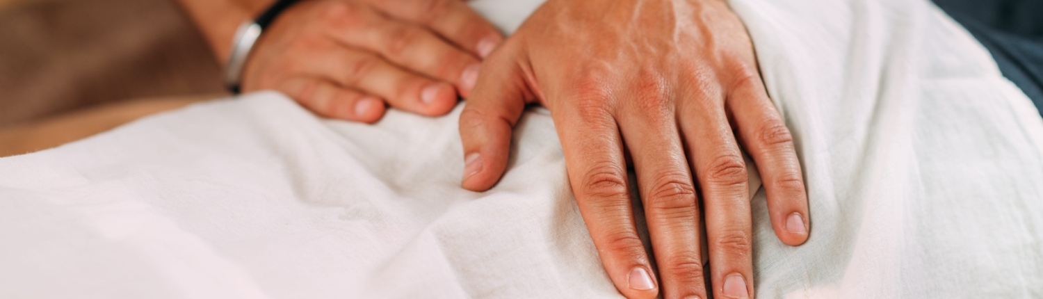 Therapist massaging womanaEUR(TM)s back. Woman getting shiatsu back massage.